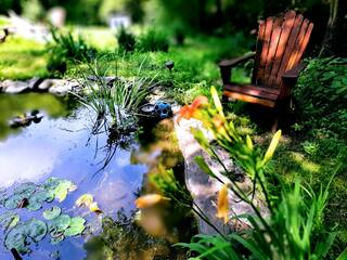Sit alongside the peaceful cement pond. at Bear Paw Splash in Gatlinburg TN