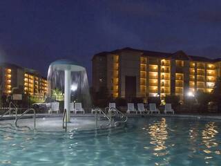 Mountain View Condos outdoor swimming pool at night.