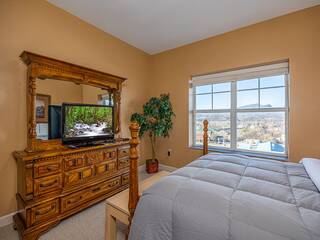 Pigeon Forge condo's 1st bedroom with television.