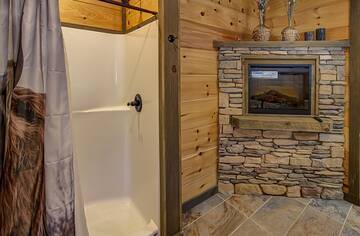 Your cabin bath with fireplace.