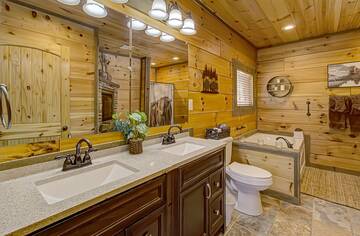 One bath in your charming cabin rental.