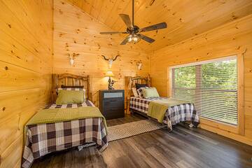 Twin beds in your cabin's bedroom upstairs.