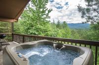 Relax in the hot tub and enjoy the beautiful Smoky Mountain scenery